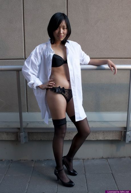 Platinum Asian teen amateur girl strips and shows her shaved pussy outdoors