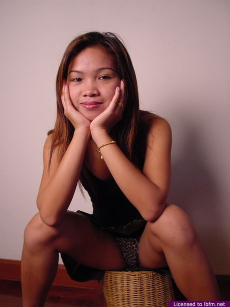 Skinny Asian babe strips off and reveals her tiny tits and pussy