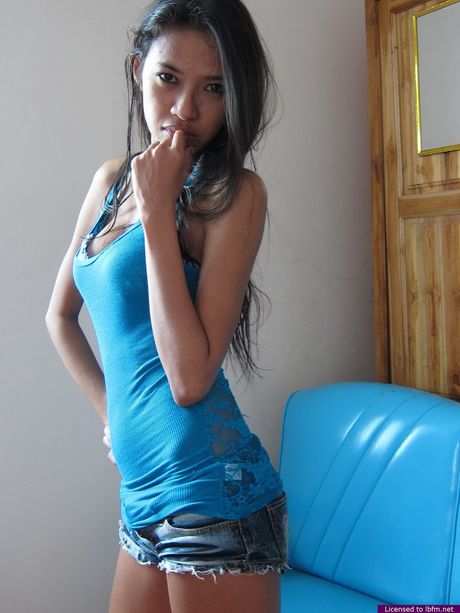 Amateur Asian girl with a big butt and tattoos gives a blowjob and rides a cock