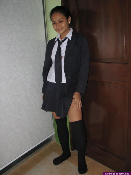 Skinny Japanese teen strips and shows her tiny tits and ass