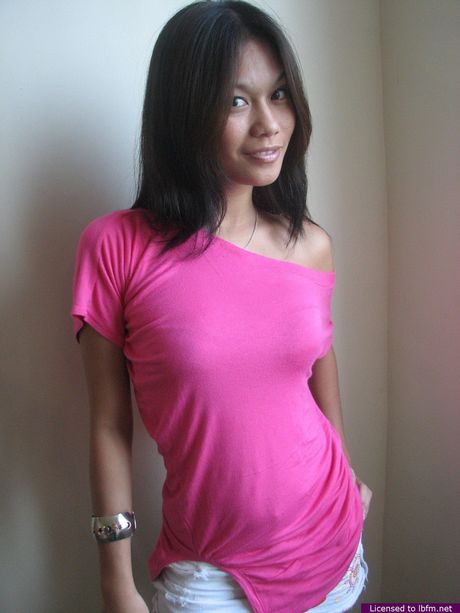 Asian amateur girl with small tits and pierced nipples strips and bares it all