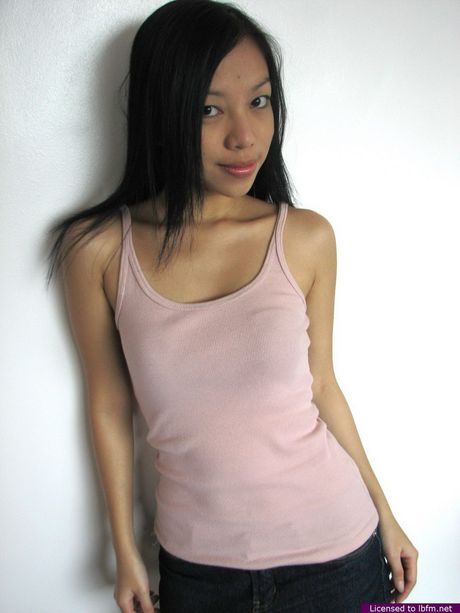 Skinny Japanese teen strips and unveils her tiny tits and ass