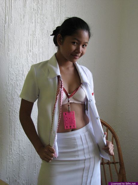 Amateur Asian girl takes off her clothes and shows her hairy pussy