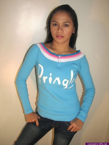 Asian teenage amateur strips off and bares her tiny tits and pussy