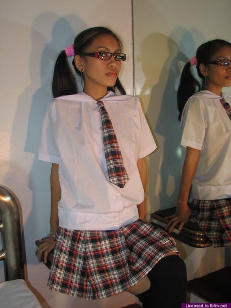 Skinny Asian teenager in glasses strips and masturbates in the classroom