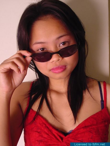 Asian teenager with small tits and a perfect ass strips and unveils her body