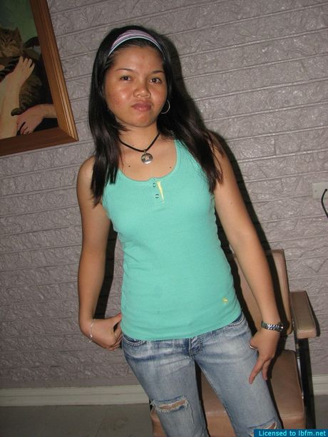 Asian amateur woman with small tits strips and shows her shaved pussy