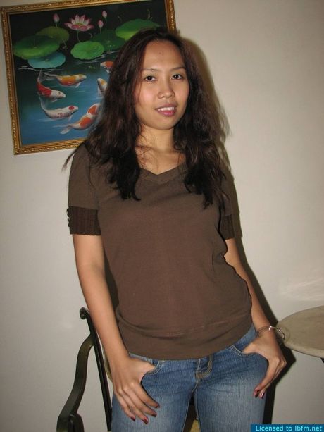 Asian teen with small tits strips and shows her hairy cunt