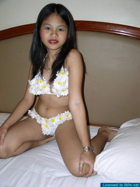 Amazing Asian teen amateur girl strips and shows her shaved pussy up close