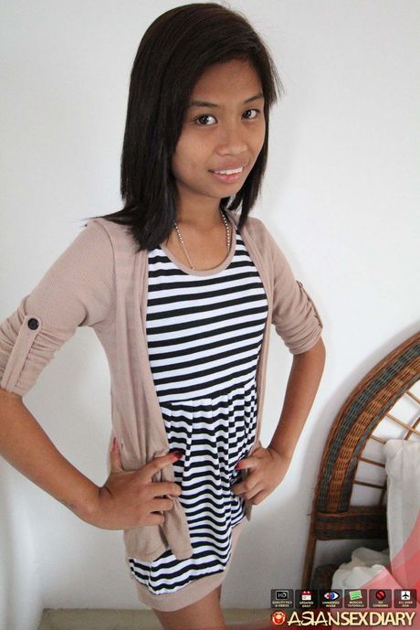 Sexy Asian teen Jonalyn shows off her tiny tits and pink pussy