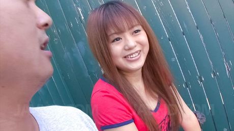 Noriko Kago Asian doll in red t-shirt takes care of phallus head