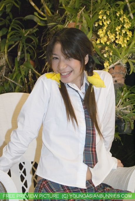 Asian schoolgirl Mekumi strips off and unveils her tiny tits and pussy