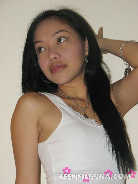 Brunette teen with a hot booty strips and exhibits perfect shape