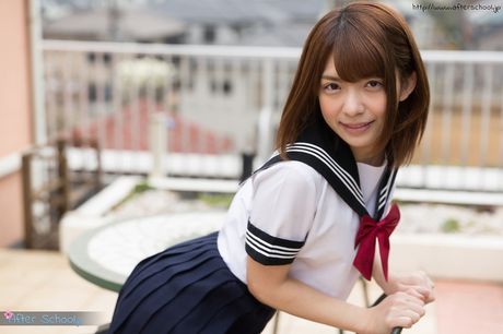 Sexy Japanese schoolgirl Mari Rika strips and shows her hairy pussy