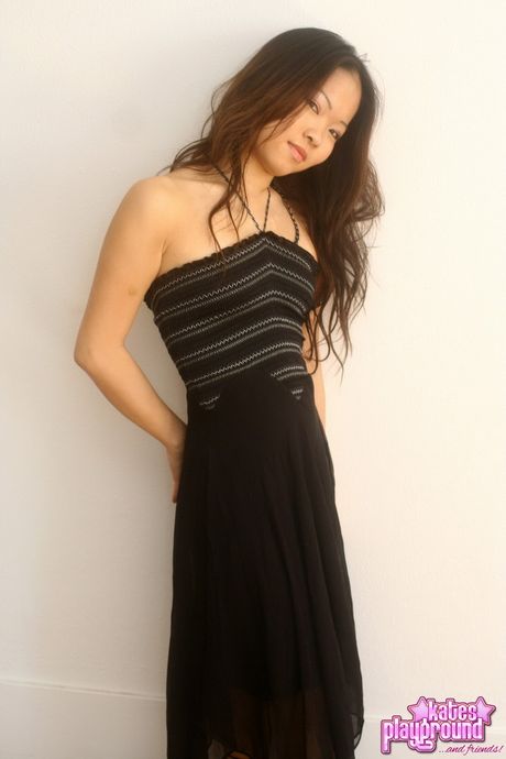 Hot Asian mom Grace strips and shows her big melons and ass in a solo