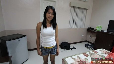 Asian mommy April strips and shows her big melons and ass in a solo