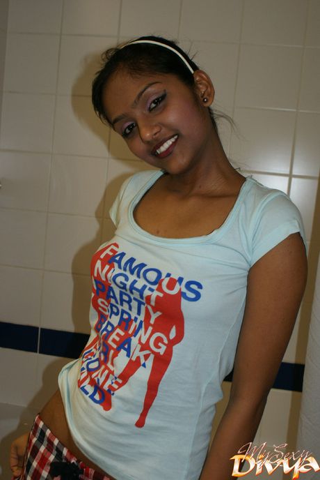 Stunning Indian teen Divya Yogesh strips and shows her tiny tits and ass
