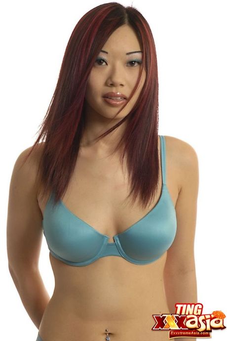 Asian babe Ting unveils her big racks and exhibits perfect shape in a solo