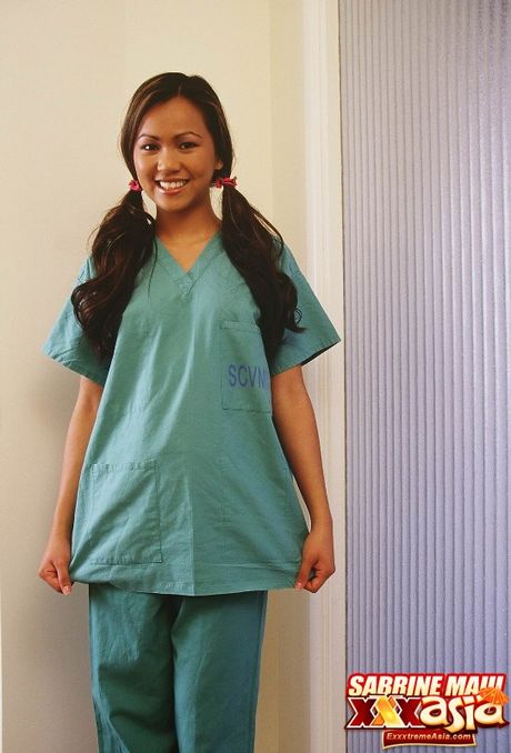 Asian nurse Sabrine Maui strips and shows her tiny tits and ass