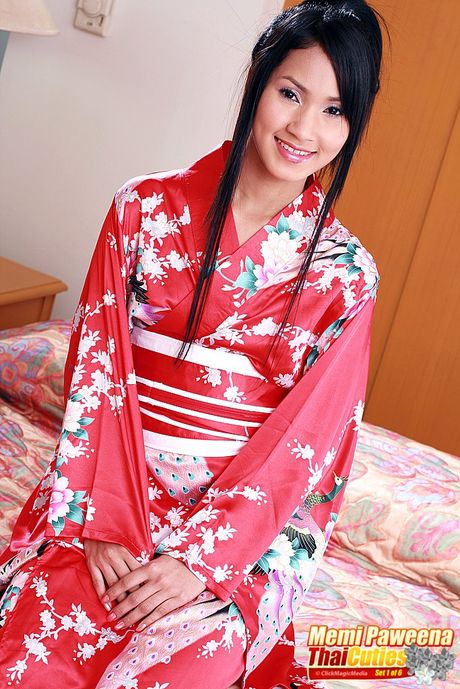 Brunette Asian babe Memi Paweena strips and shows her tiny tits and pussy