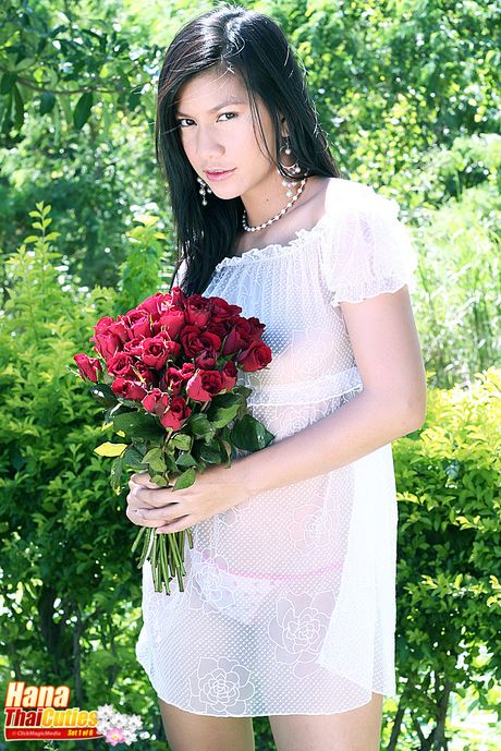 Superb Asian teen Hana strips and shows her big racks and ass in the backyard