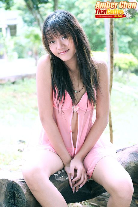 Asian teen Amber Chan toying her pussy with a dildo in the outdoors