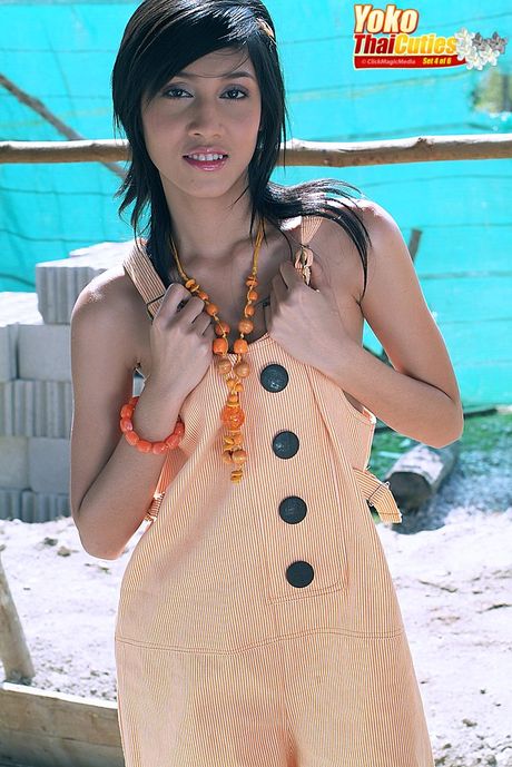 Asian babe Yoko highlights her tiny tits and her delicious ass on the beach