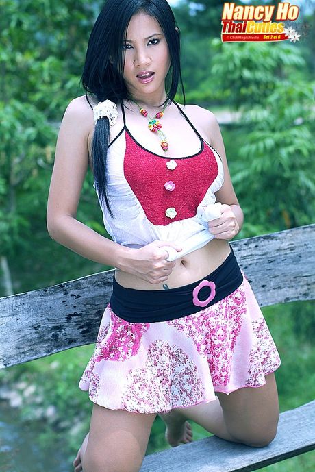 Asian MILF Nancy Ho exhibits her big juggs and toys her horny pussy outdoors