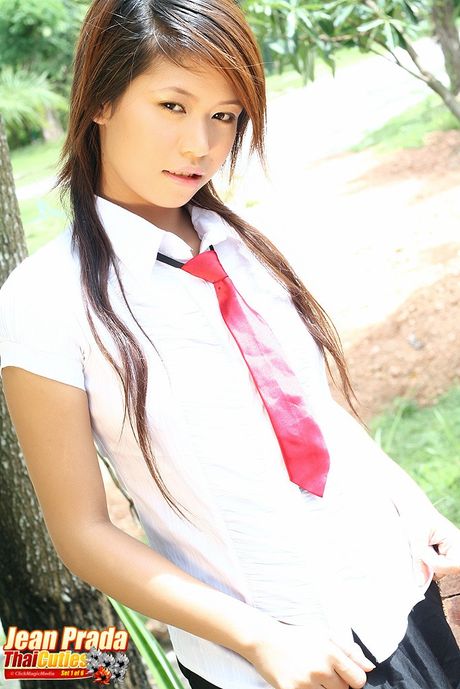 Super hot Asian schoolgirl Jean Prada strips and shows her tiny tits and ass