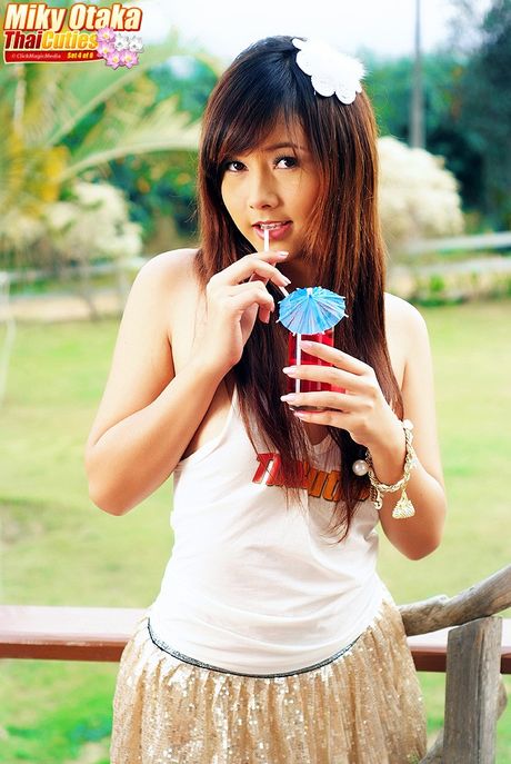 Sexy Asian babe Miky Otaka toying her amazing racks and pussy in the backyard