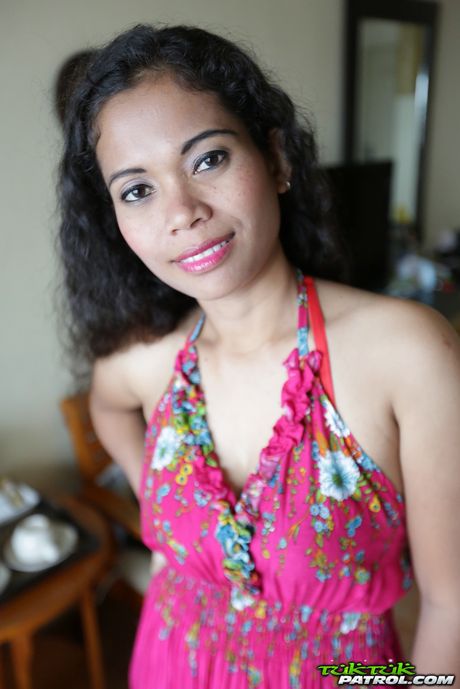 Asian teen Nees strips and shows her tiny tits and shaved pussy