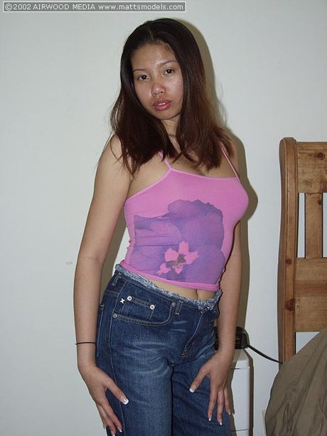 Asian teen Nika strips and reveals her perfect ass and tits in a solo