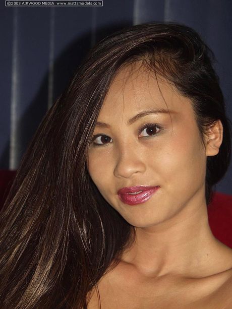 Asian amateur Lisa Linn shows her tiny tits and spreads her pussy in a solo scene