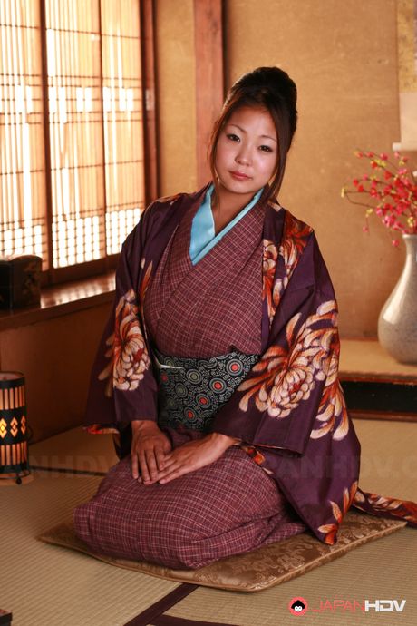 Beautiful Japanese gal shows her big naturals and that hairy twat