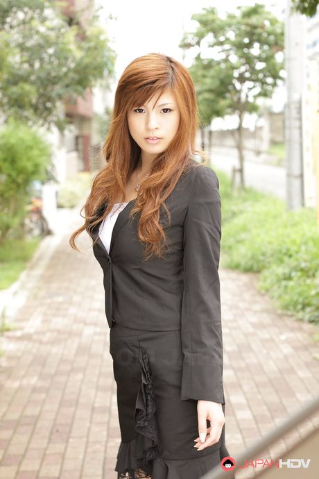 Stunning redhead office lady Rina Kikukawa posing outdoors with joy