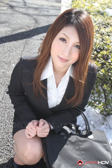 Sweet office lady in a sexy suit Rara Mizuki posing outdoors with joy