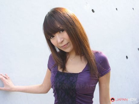 Slutty brunette porn queen Jun Kusanagi teasing her twat outdoors