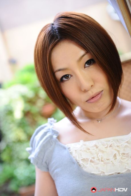 Short haired brunette wife Hiromi Tominaga shows off her body outdoors