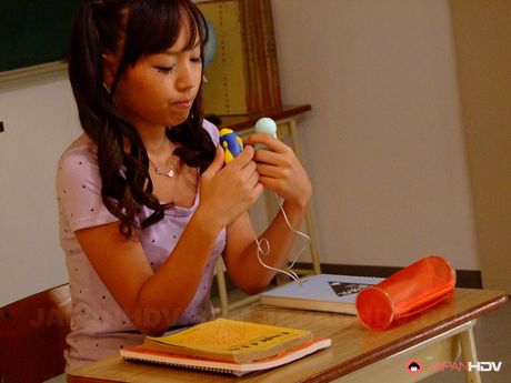 Cute schoolgirl Nagisa drills her cunt with passion in the classroom