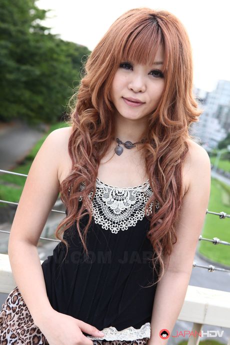 Shameless Sarina Tsubaki poses and exposes her creamy tits outdoors.