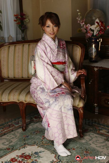 Hot Japanese babe Kaede Moritaka shows her pussy on sofa and enjoys