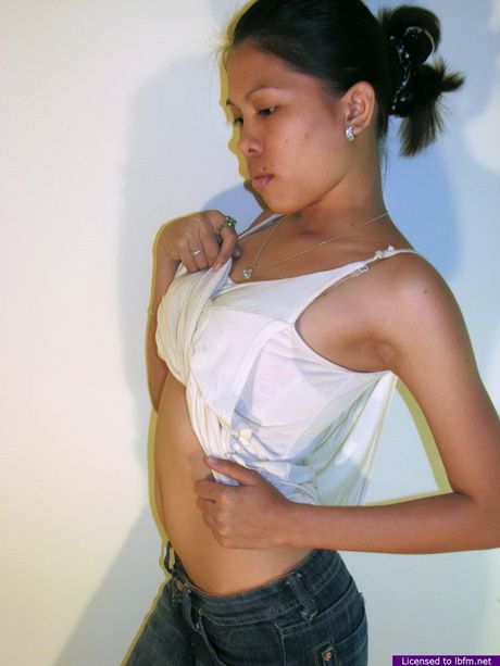 Japanese amateur woman with tiny tits strips off and reveals her shaved pussy