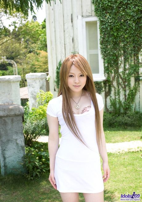 Platinum Asian babe Ria Sakurai strips and demonstrates her big ass and tits