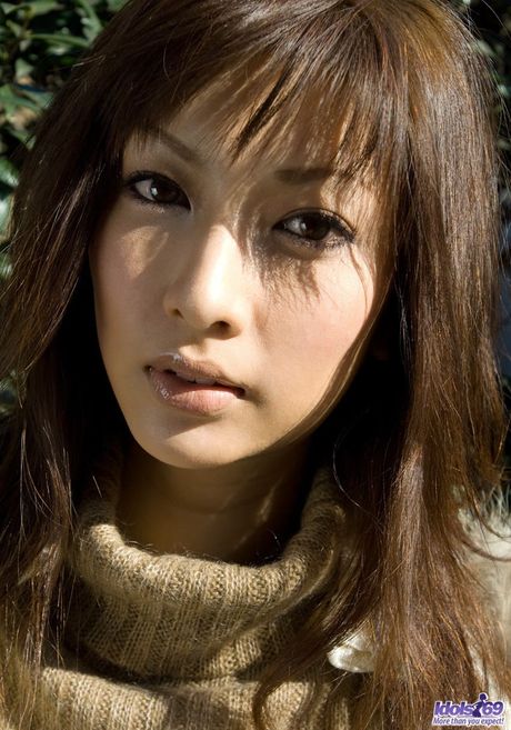 Sexy Asian babe Reika strips and shows her big ass and tits in a kitchen