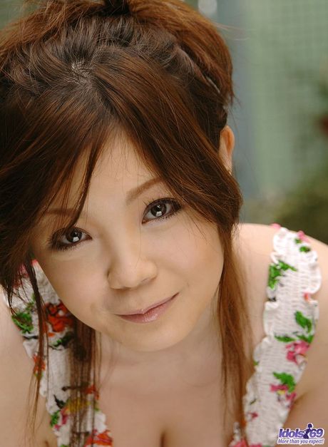 Sexy Asian MILF Nami Ogawa strips in the kitchen and shows her big racks