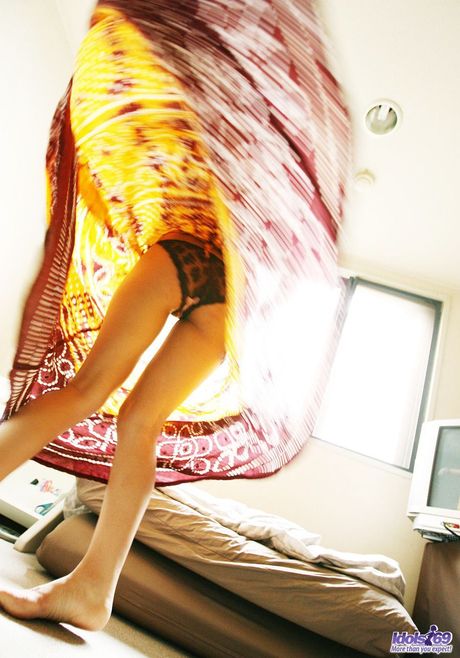 Amazing Asian teen Reina strips and shows her tiny tits and hairy pussy