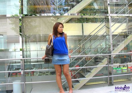 Asian babe Yuki strips and reveals her tiny tits and ass in a solo