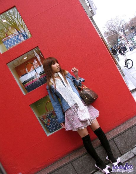 Hot Asian babe Ruri strips and shows her hot ass in a hot bath