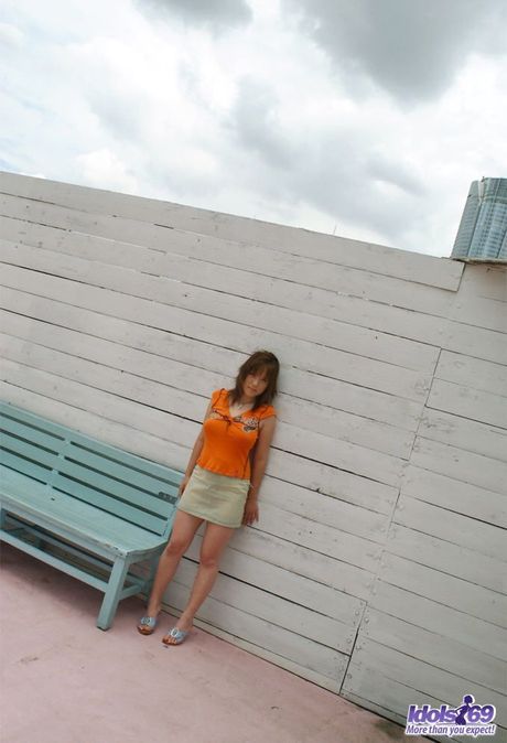 Asian beauty is a naughty slut who likes to show her ass and  firm round tits