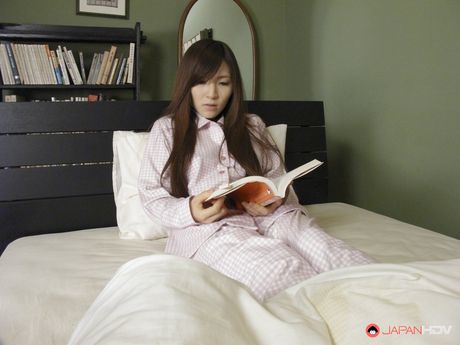 Hitomi Tsukishiro gets horny and uses toy on her pussy before sleep.